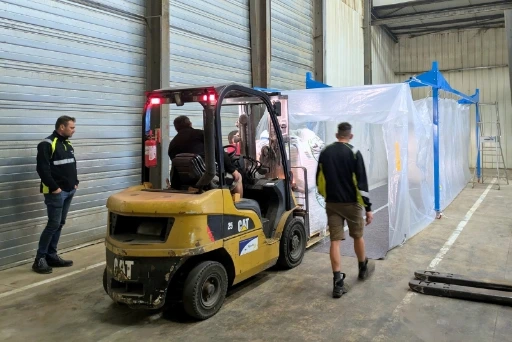 Forklift operators filling hermetic Nox Mega Bag in warehouse grain storage area Forklift operators filling hermetic Nox Mega Bag in warehouse grain storage area